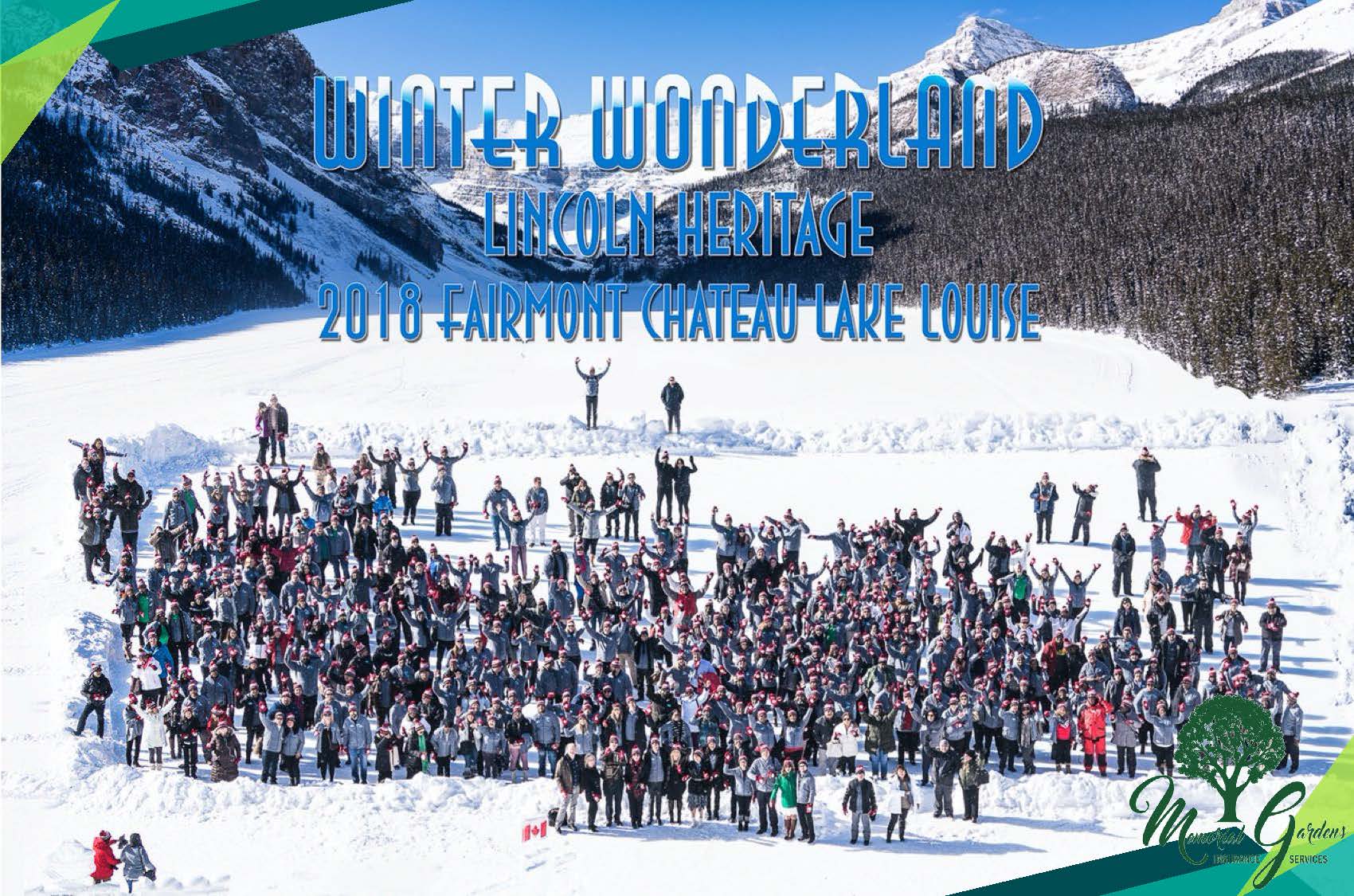 A large group of people standing on top of a snow covered slope.