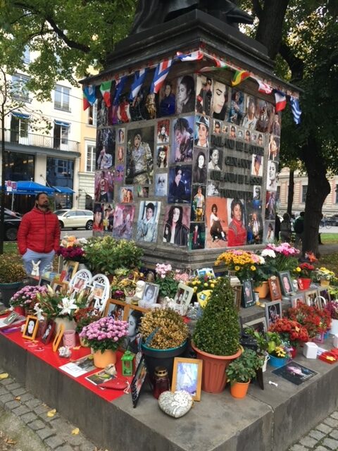 A memorial with pictures of people who have passed away.