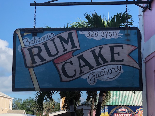 A sign for the rum cake factory in bahamas.